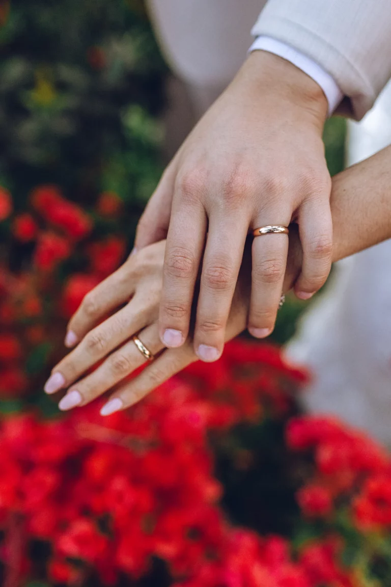 wedding couple holding luxury wedding rings